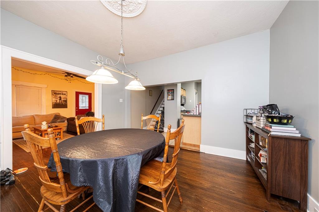 4263 Evergreen Road Pittsburgh, PA 15214 - Photo 10 of 24 a view of a dining room with furniture and wooden floor