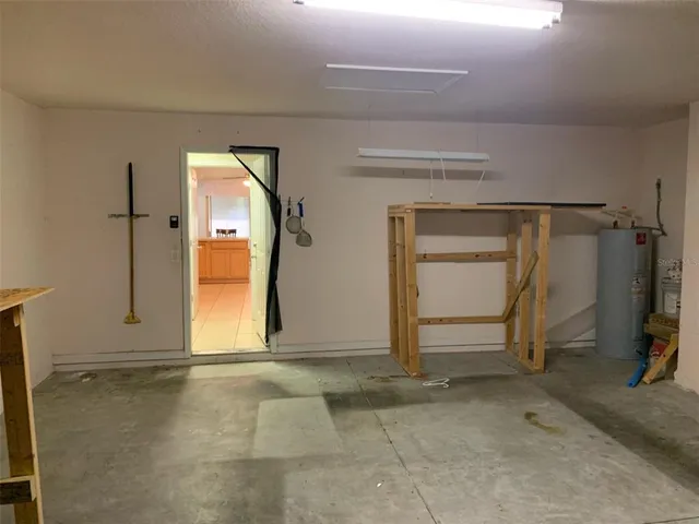 an empty room with closet and mirror