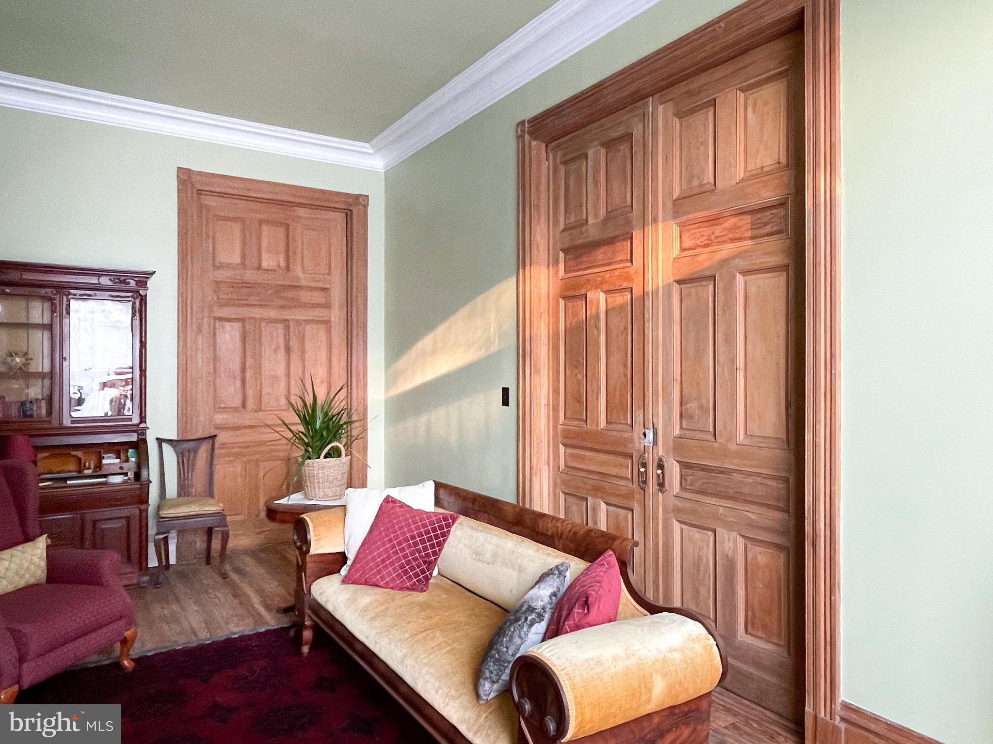 1931 St Paul Street Baltimore, MD 21218 - Photo 4 of 58 Living room with pocket doors closed
