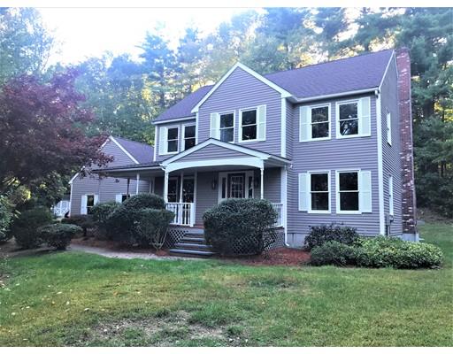 21 Wamsutta Ridge Road Charlton, MA 01507 - Photo 1 of 42 a front view of a house with a yard and trees