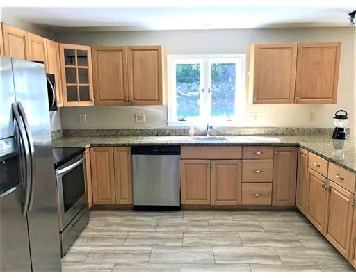 21 Wamsutta Ridge Road Charlton, MA 01507 - Photo 12 of 42 a kitchen with stainless steel appliances granite countertop a stove a sink dishwasher a refrigerator and a microwave oven