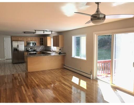 21 Wamsutta Ridge Road Charlton, MA 01507 - Photo 14 of 42 a kitchen with stainless steel appliances granite countertop a stove and cabinets