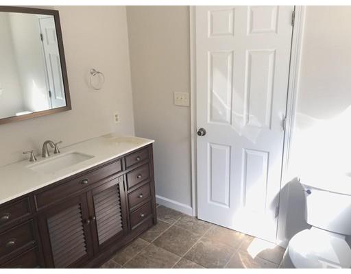 21 Wamsutta Ridge Road Charlton, MA 01507 - Photo 29 of 42 a spacious bathroom with a double vanity sink and a mirror