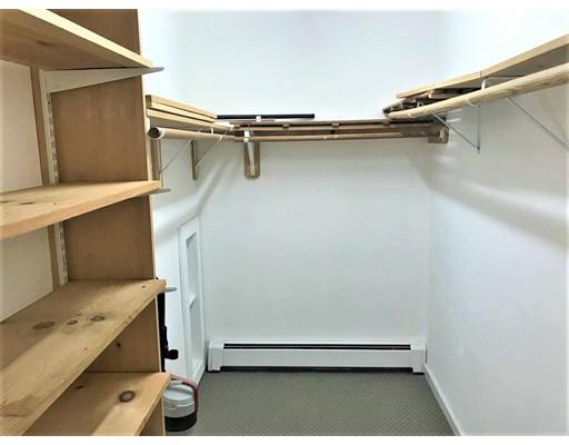 21 Wamsutta Ridge Road Charlton, MA 01507 - Photo 31 of 42 a view of a room with racks on the wall
