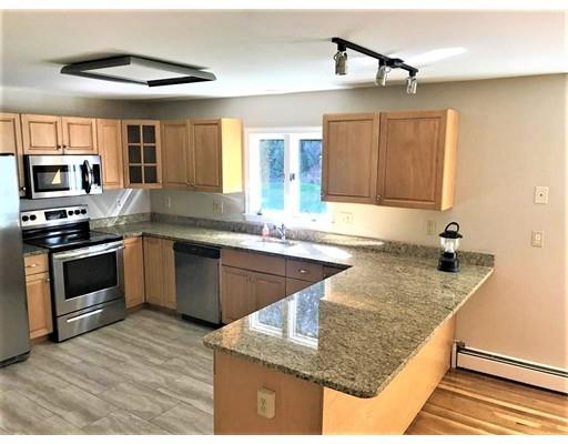 21 Wamsutta Ridge Road Charlton, MA 01507 - Photo 10 of 42 a kitchen with stainless steel appliances granite countertop a sink stove and cabinets