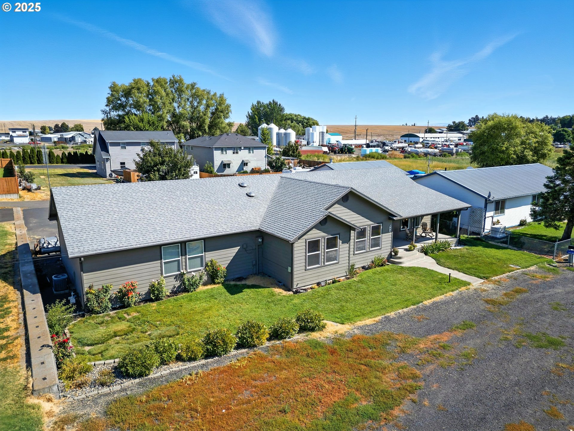 257 West Lincoln Street Athena, OR 97813 - Photo 1 of 37 a aerial view of a house with a big yard plants and large trees
