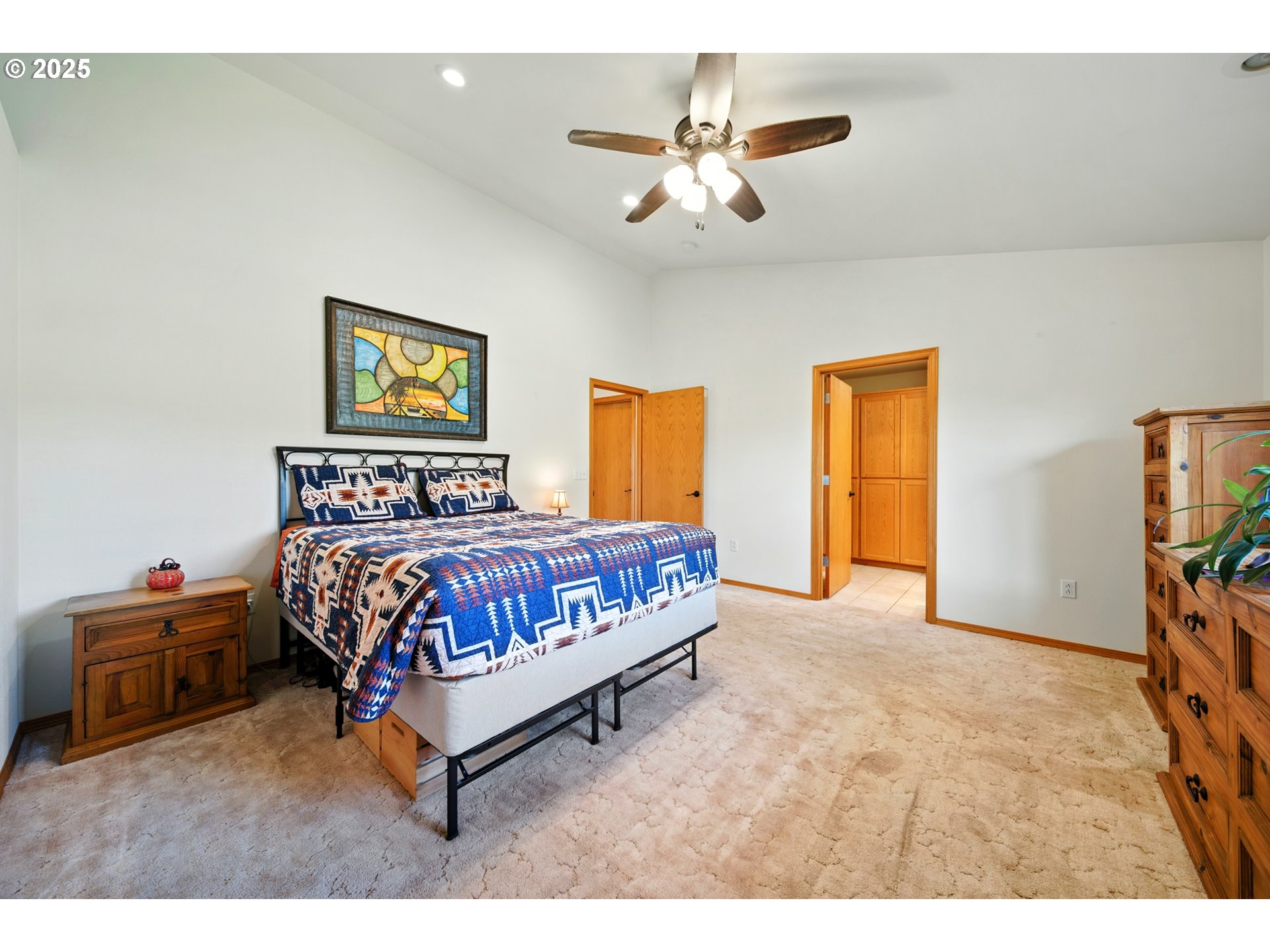 257 West Lincoln Street Athena, OR 97813 - Photo 20 of 37 a bedroom with a bed and a chandelier