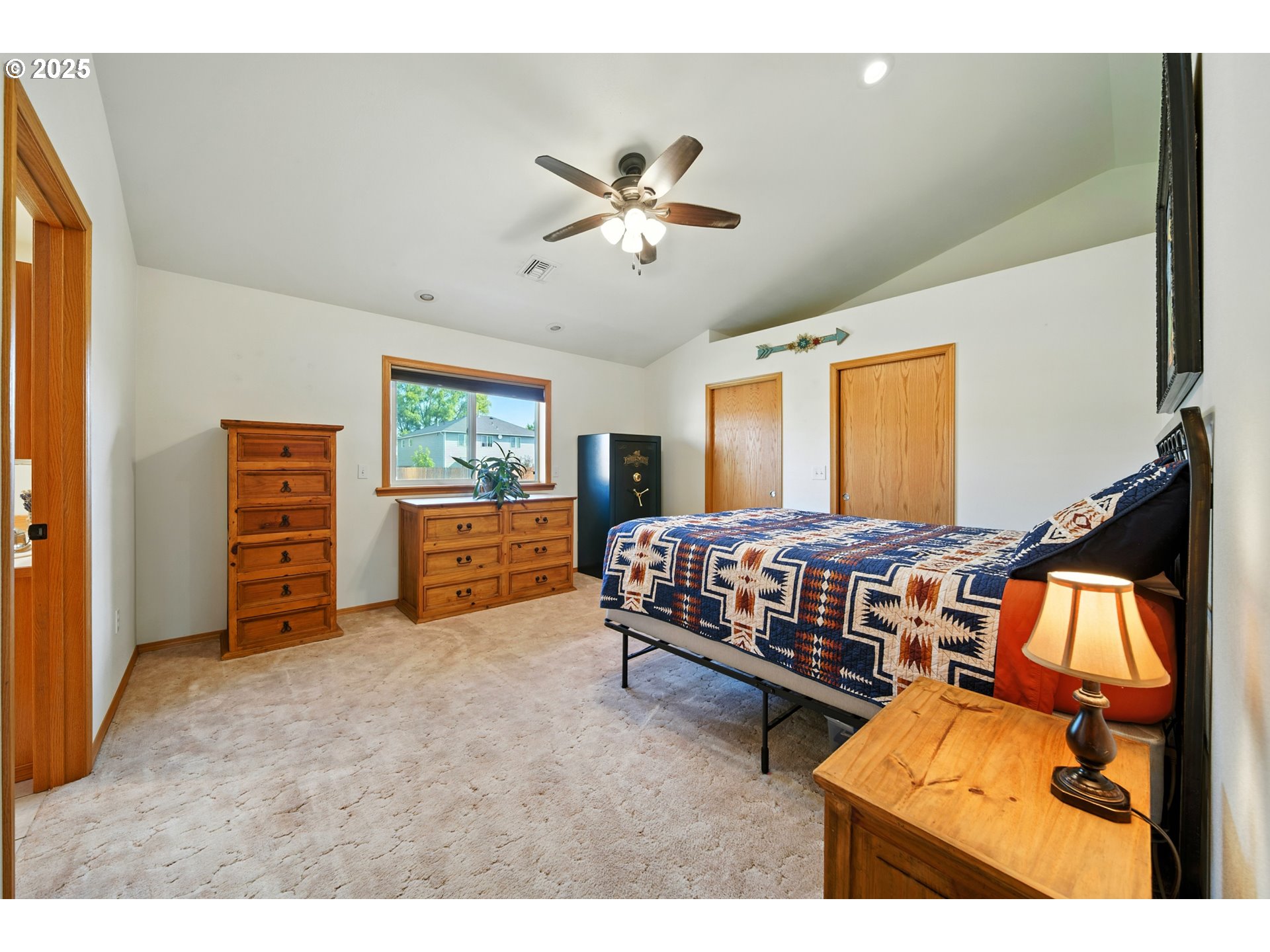 257 West Lincoln Street Athena, OR 97813 - Photo 21 of 37 a bedroom with a bed and a chandelier
