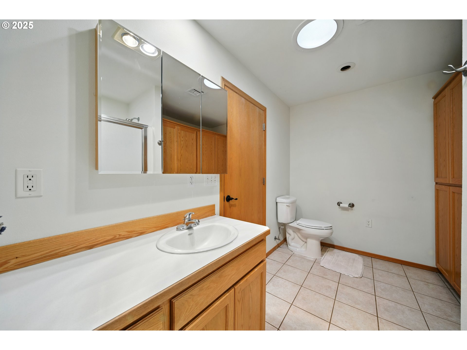 257 West Lincoln Street Athena, OR 97813 - Photo 23 of 37 a bathroom with a sink a toilet and a mirror