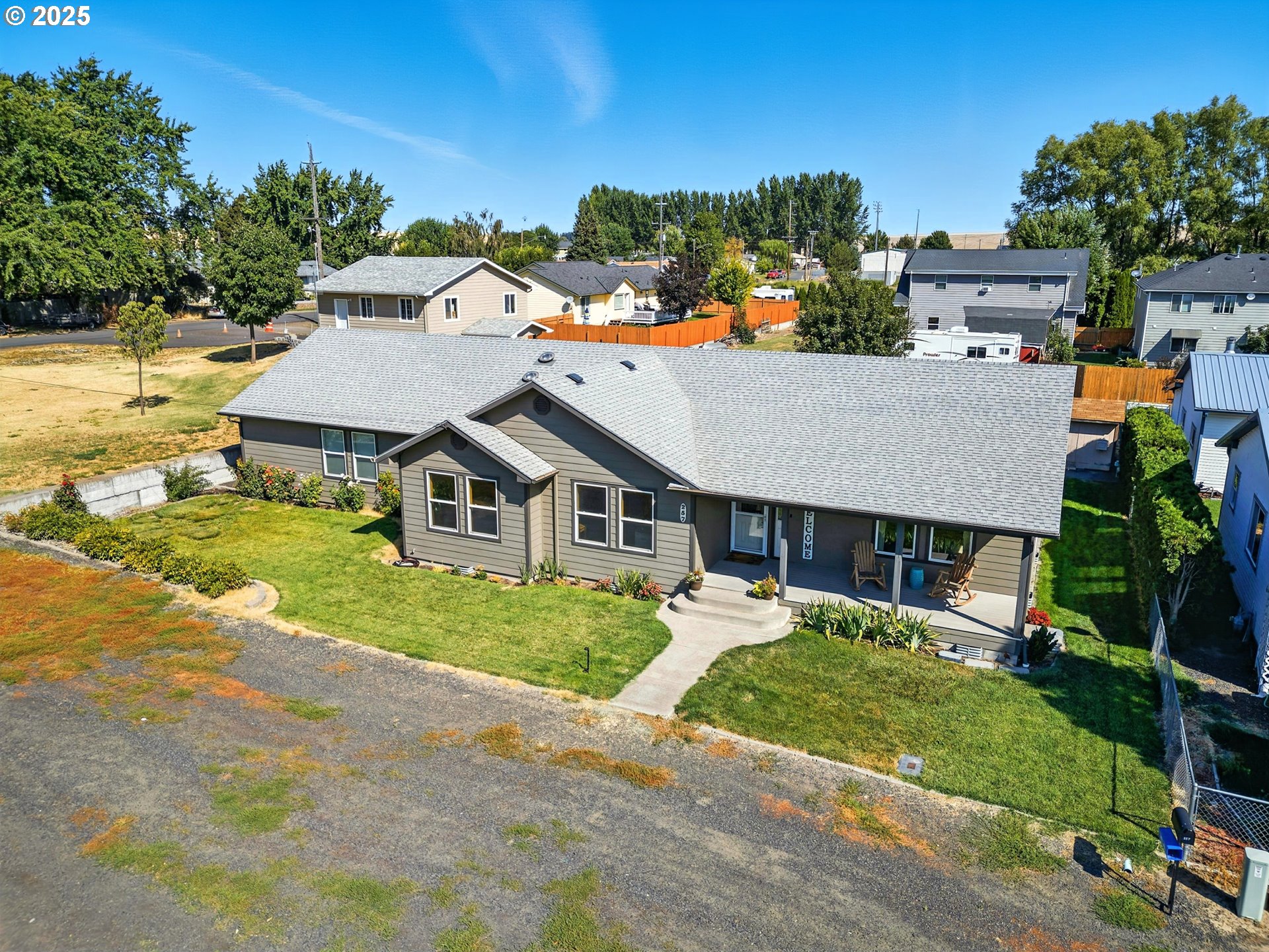 257 West Lincoln Street Athena, OR 97813 - Photo 29 of 37 an aerial view of a house with a yard and lake view