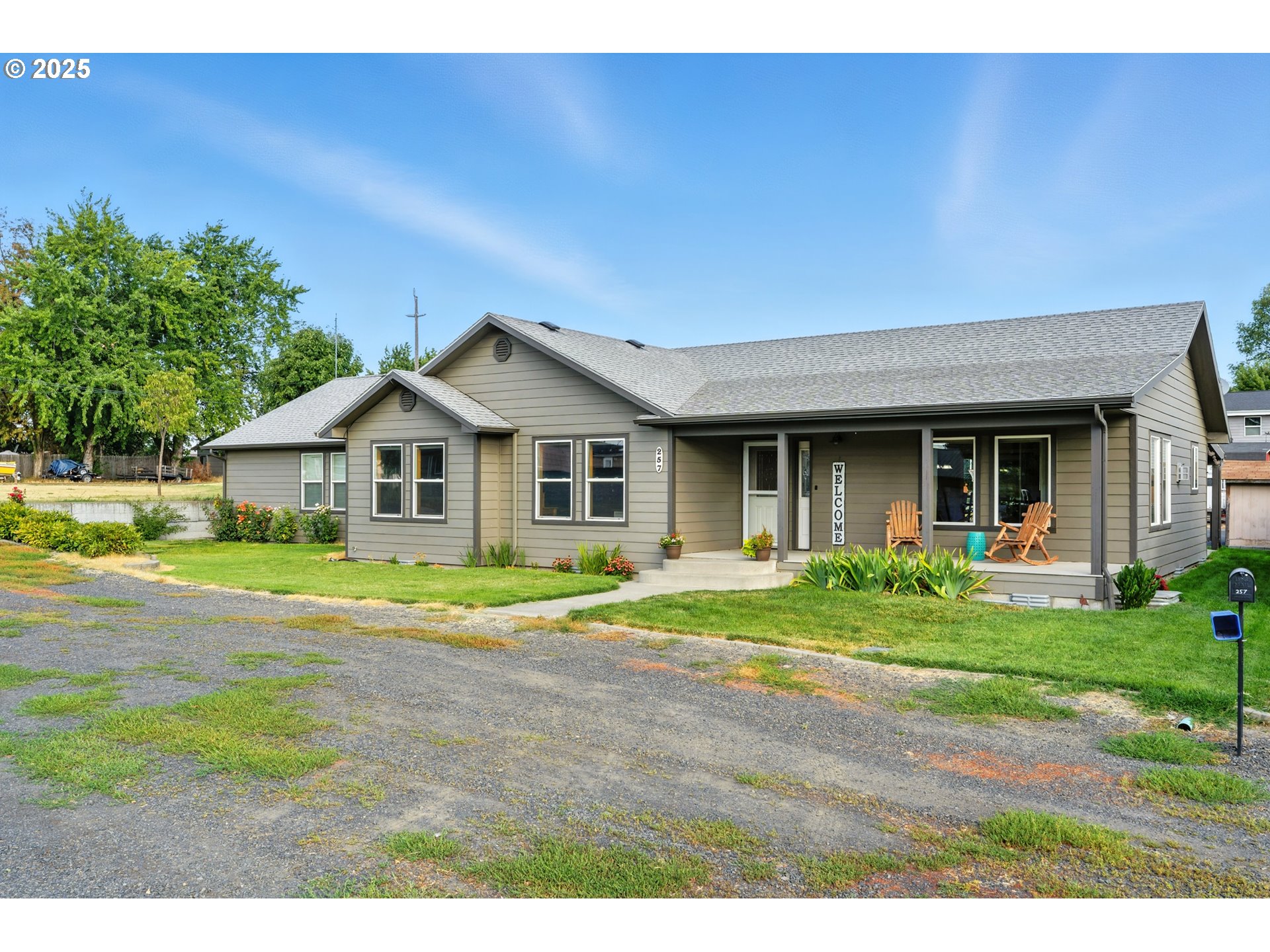 257 West Lincoln Street Athena, OR 97813 - Photo 3 of 37 a front view of a house with a yard and porch