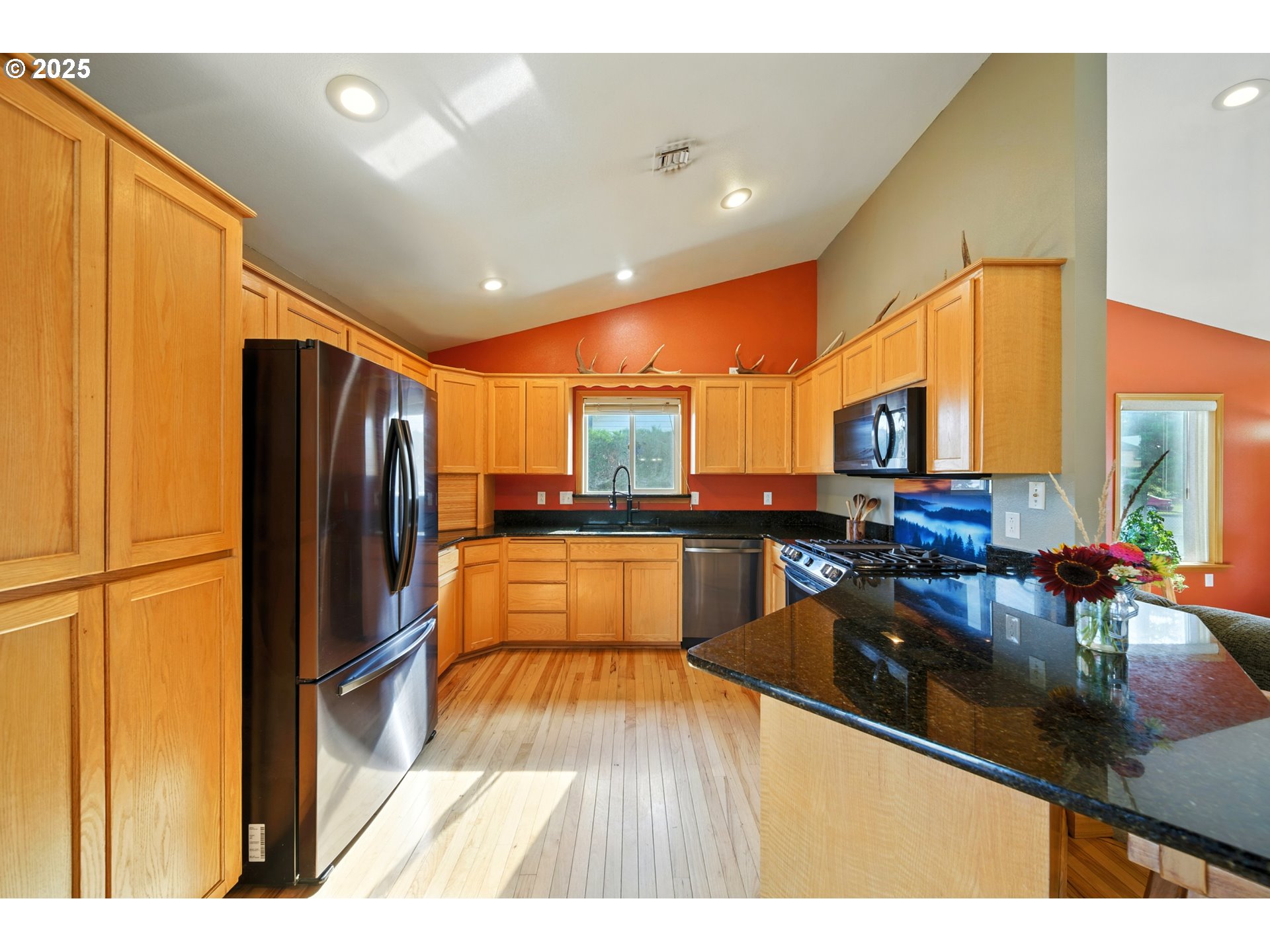 257 West Lincoln Street Athena, OR 97813 - Photo 9 of 37 a kitchen with stainless steel appliances granite countertop a refrigerator a sink and a stove