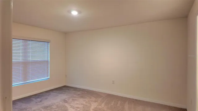a bathroom with a granite countertop toilet a sink and a bathtub