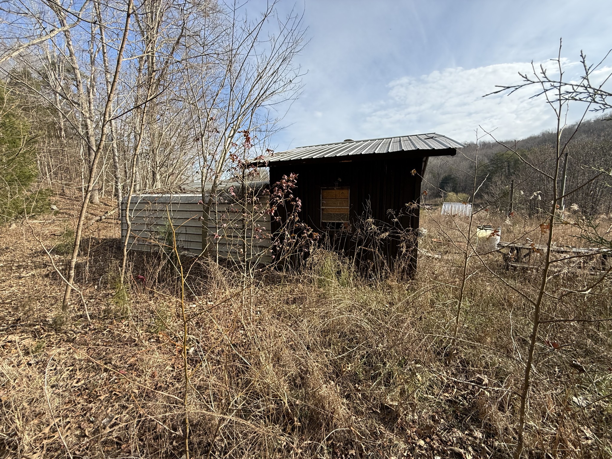 4819 Morrison Creek Road Clifton, TN 38425 - Photo 9 of 19 a view of a patio with table and chairs with wooden fence