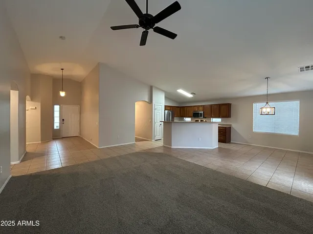a view of a kitchen with a sink and a window