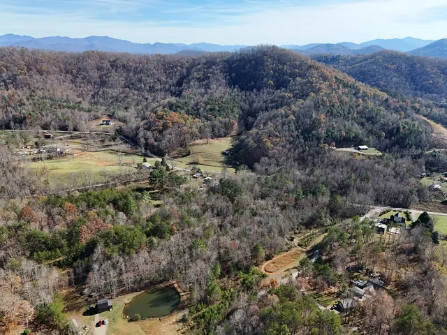 a view of a town with mountains in the background