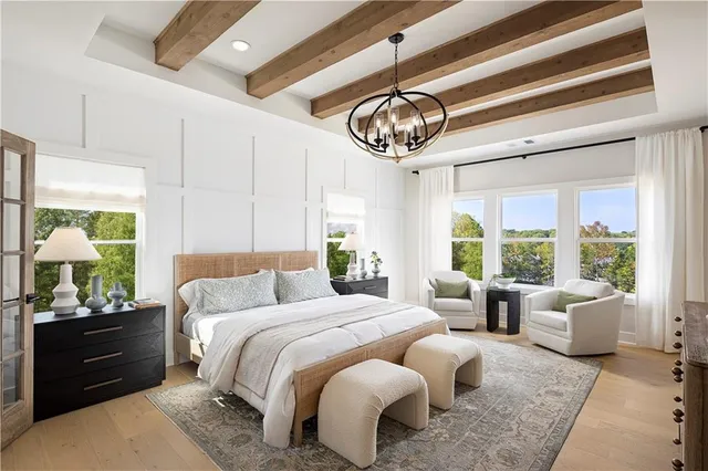 a spacious bathroom with a tub sink and mirror