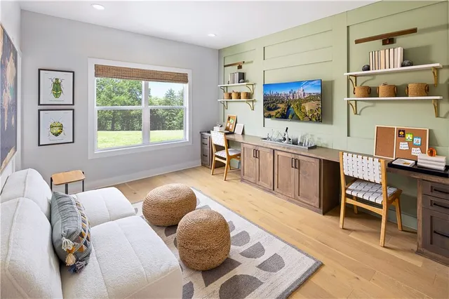 a bedroom with a bed mirror and a window