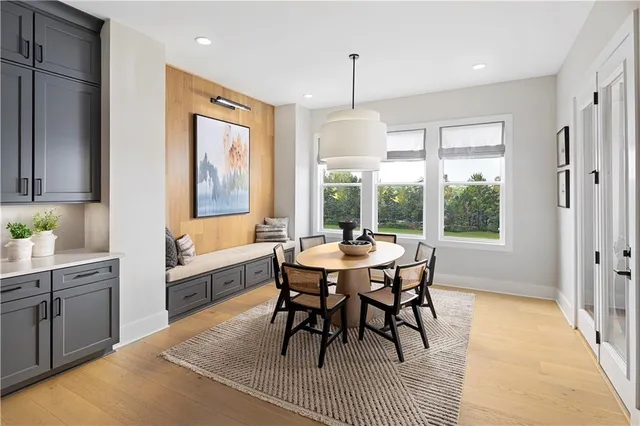 a living room with fireplace furniture and a large window
