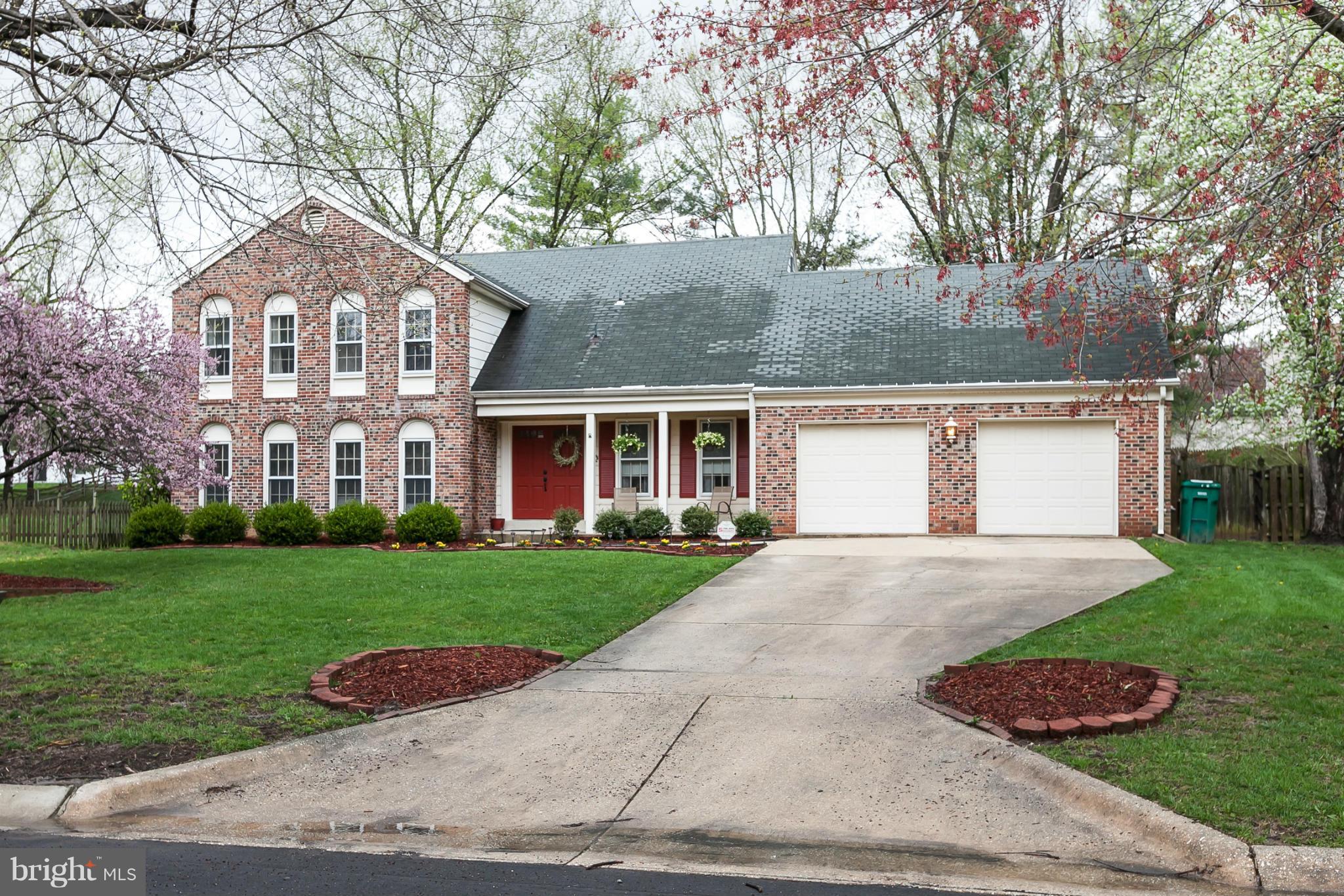 13708 Lockdale Road Silver Spring, MD 20906 - Photo 1 of 30 a front view of a house with a yard and garage