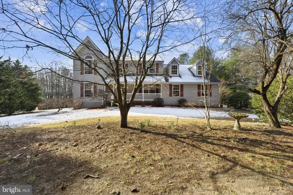 a swimming pool in middle of green field