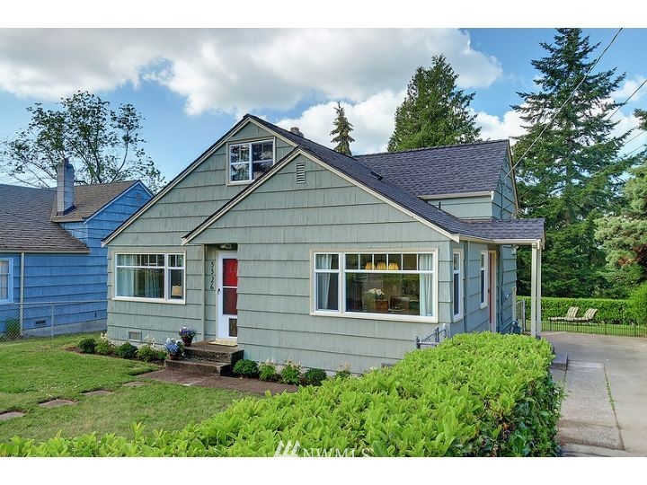 5326 South Hazel Street Seattle, WA 98178 - Photo 1 of 13 a view of a house with yard and garden