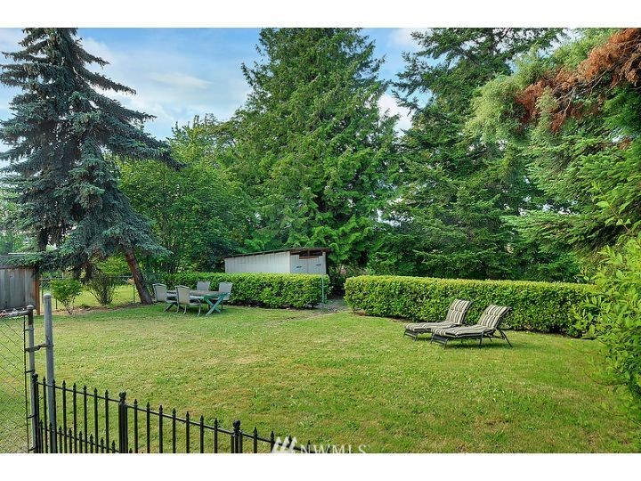 5326 South Hazel Street Seattle, WA 98178 - Photo 12 of 13 a view of a garden with a bench