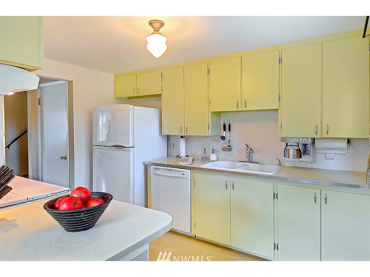 5326 South Hazel Street Seattle, WA 98178 - Photo 5 of 13 a kitchen with stainless steel appliances a sink and a refrigerator