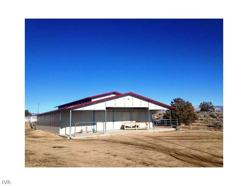 4700 Axe Handle Canyon Road Reno, NV 89510 - Photo 2 of 25 a view of a house with a yard