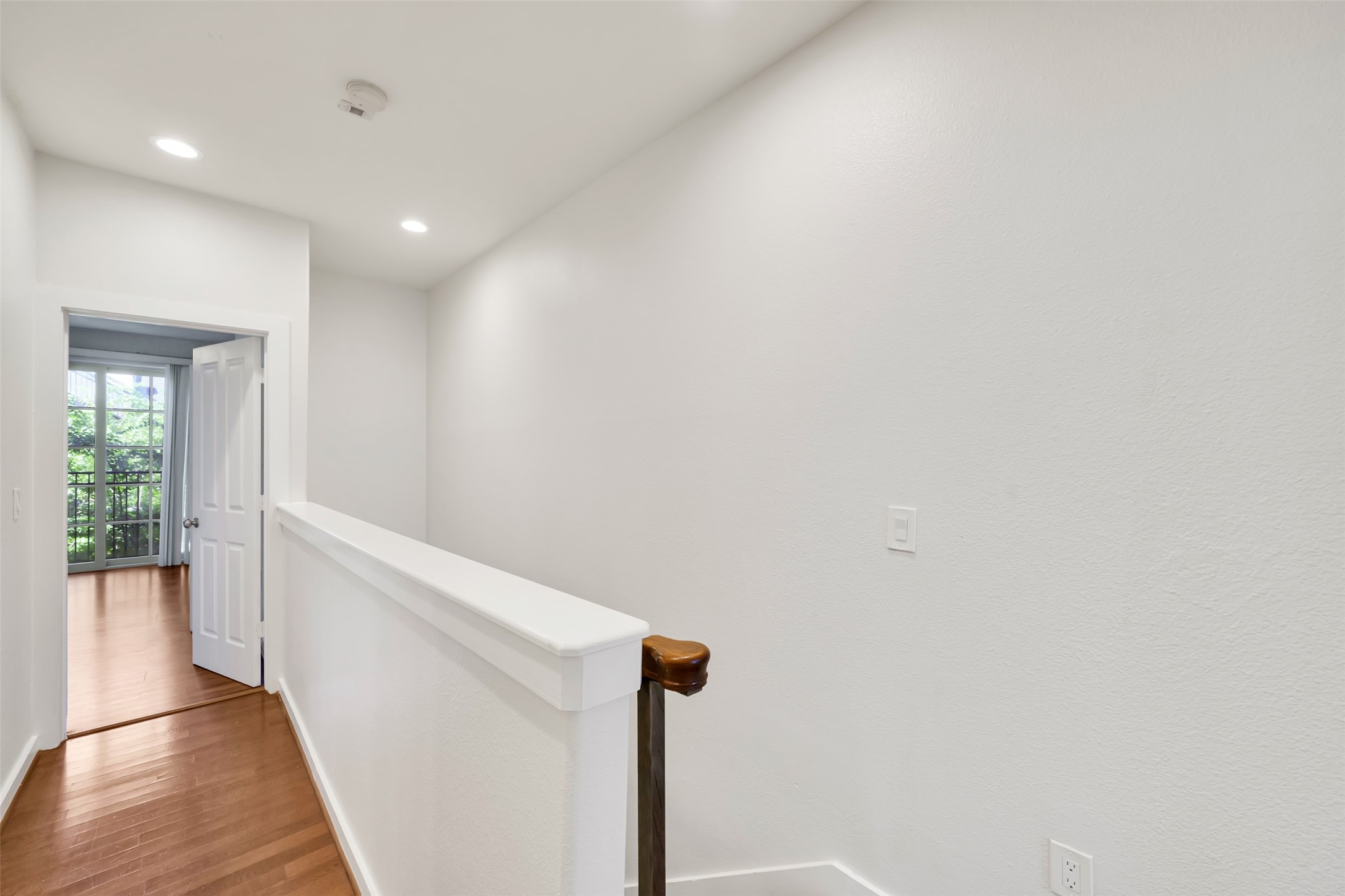 2216 Chenevert Street, Unit 6 Houston, TX 77003 - Photo 21 of 29 Top of the stairs, leading to the main bathroom and primary suite.