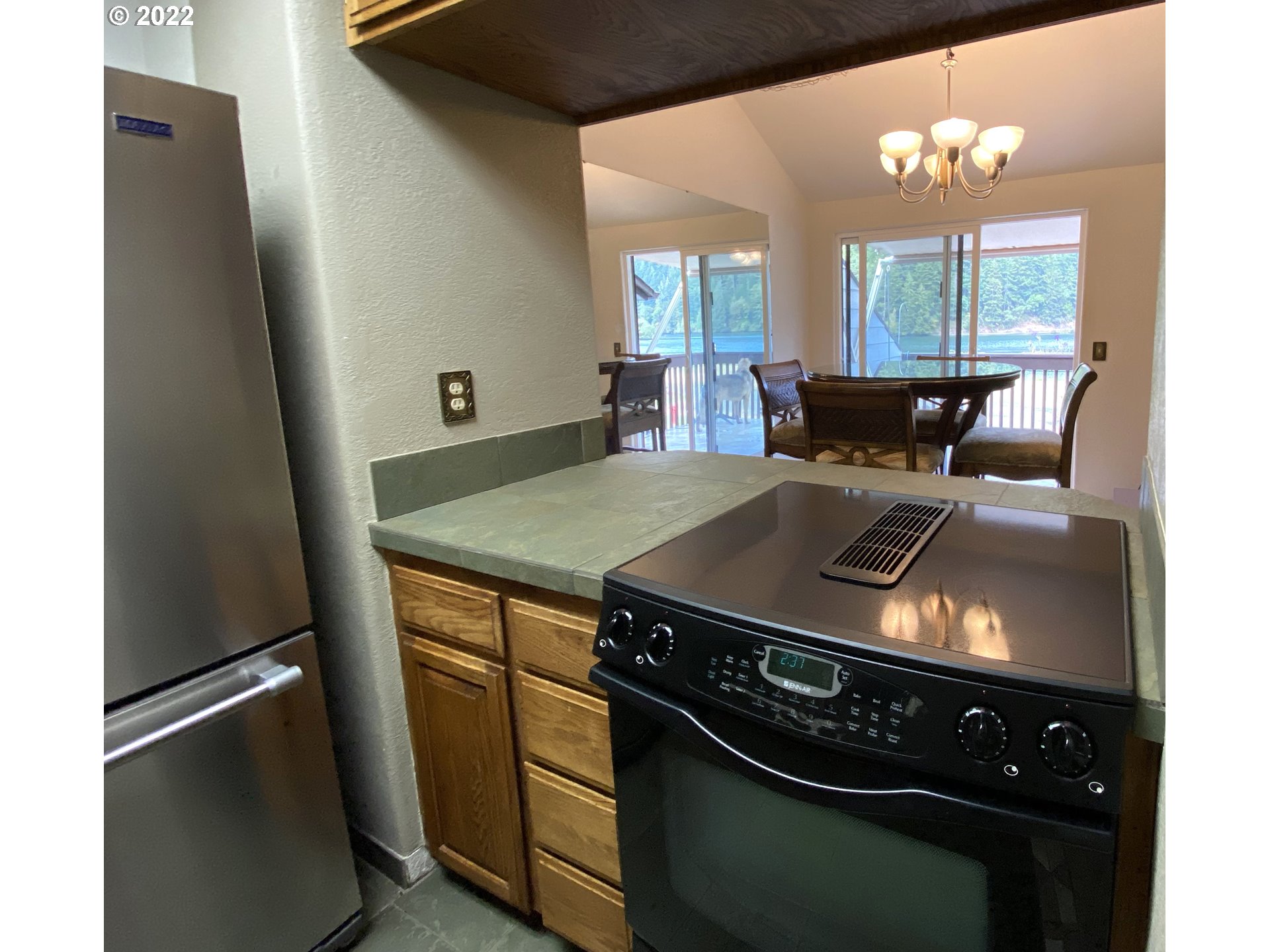 43605 Highway 38, Unit 24 Reedsport, OR 97467 - Photo 14 of 27 a kitchen with a stove and a refrigerator