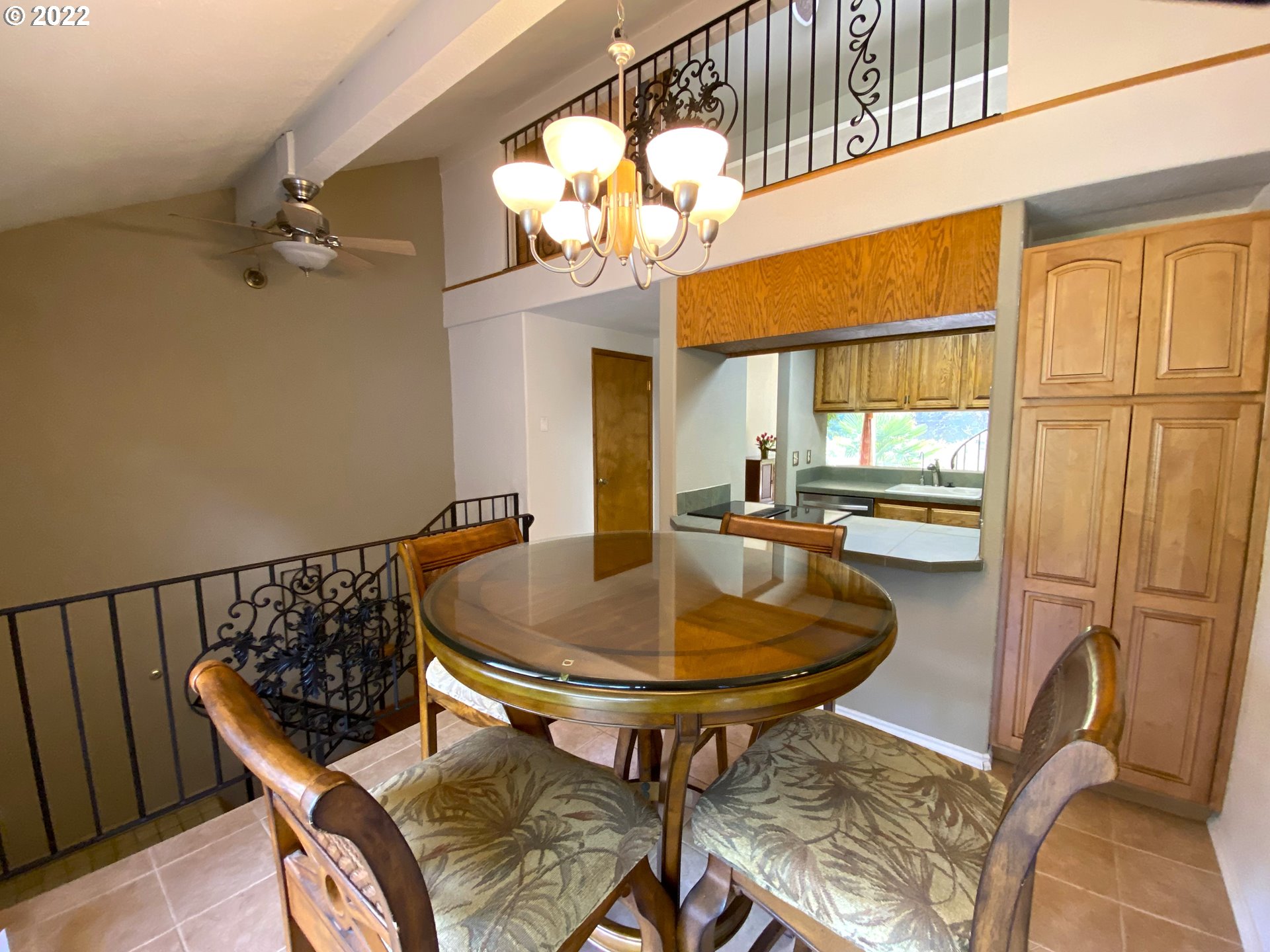 43605 Highway 38, Unit 24 Reedsport, OR 97467 - Photo 16 of 27 a view of a dining room with furniture and a chandelier