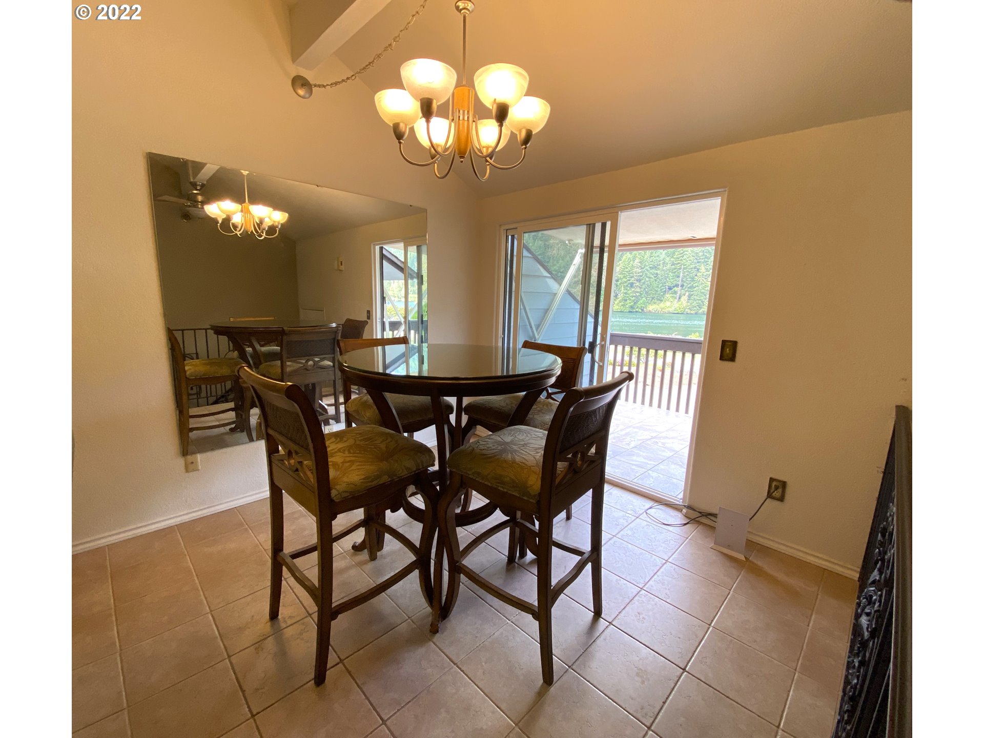 43605 Highway 38, Unit 24 Reedsport, OR 97467 - Photo 17 of 27 a view of a dining room with furniture and chandelier