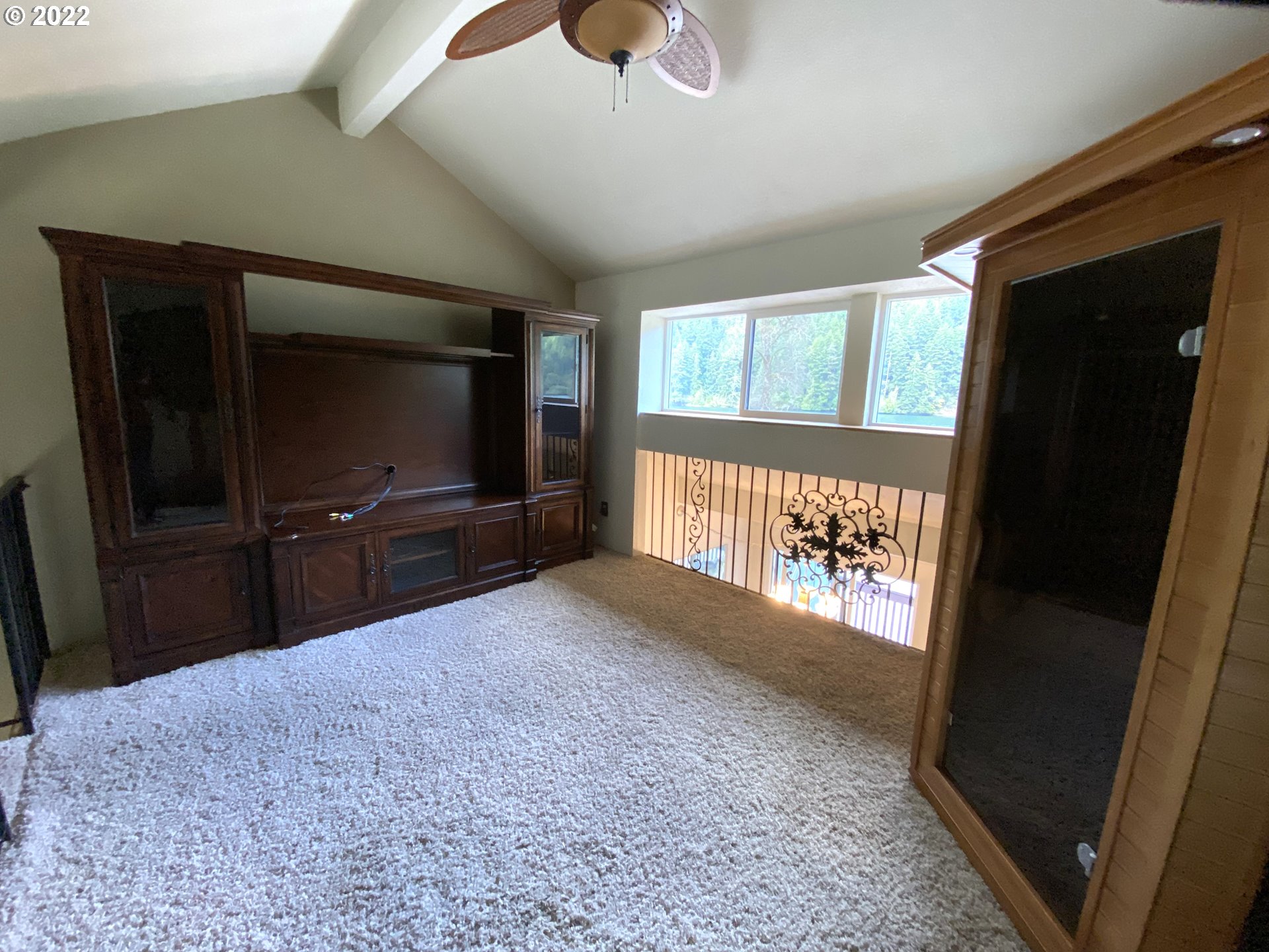 43605 Highway 38, Unit 24 Reedsport, OR 97467 - Photo 18 of 27 a living room with a flat tv screen and a rug