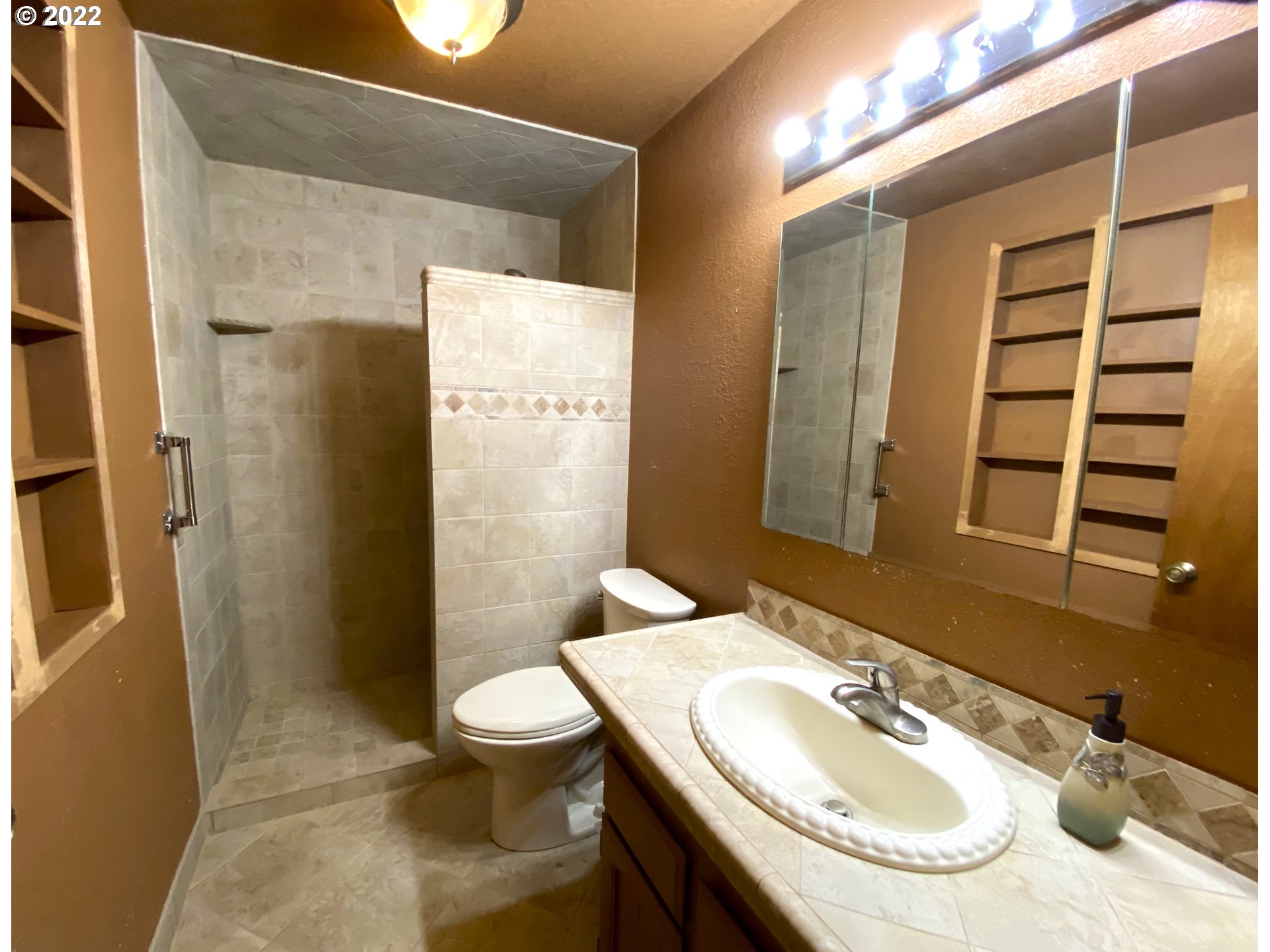 43605 Highway 38, Unit 24 Reedsport, OR 97467 - Photo 21 of 27 a bathroom with a sink a toilet and shower