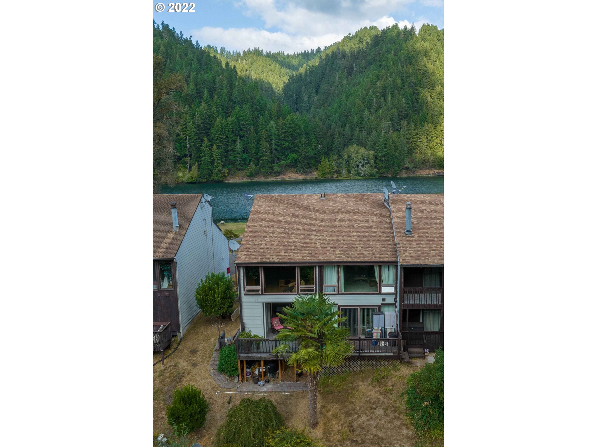 43605 Highway 38, Unit 24 Reedsport, OR 97467 - Photo 5 of 27 a aerial view of a house with swimming pool and furniture