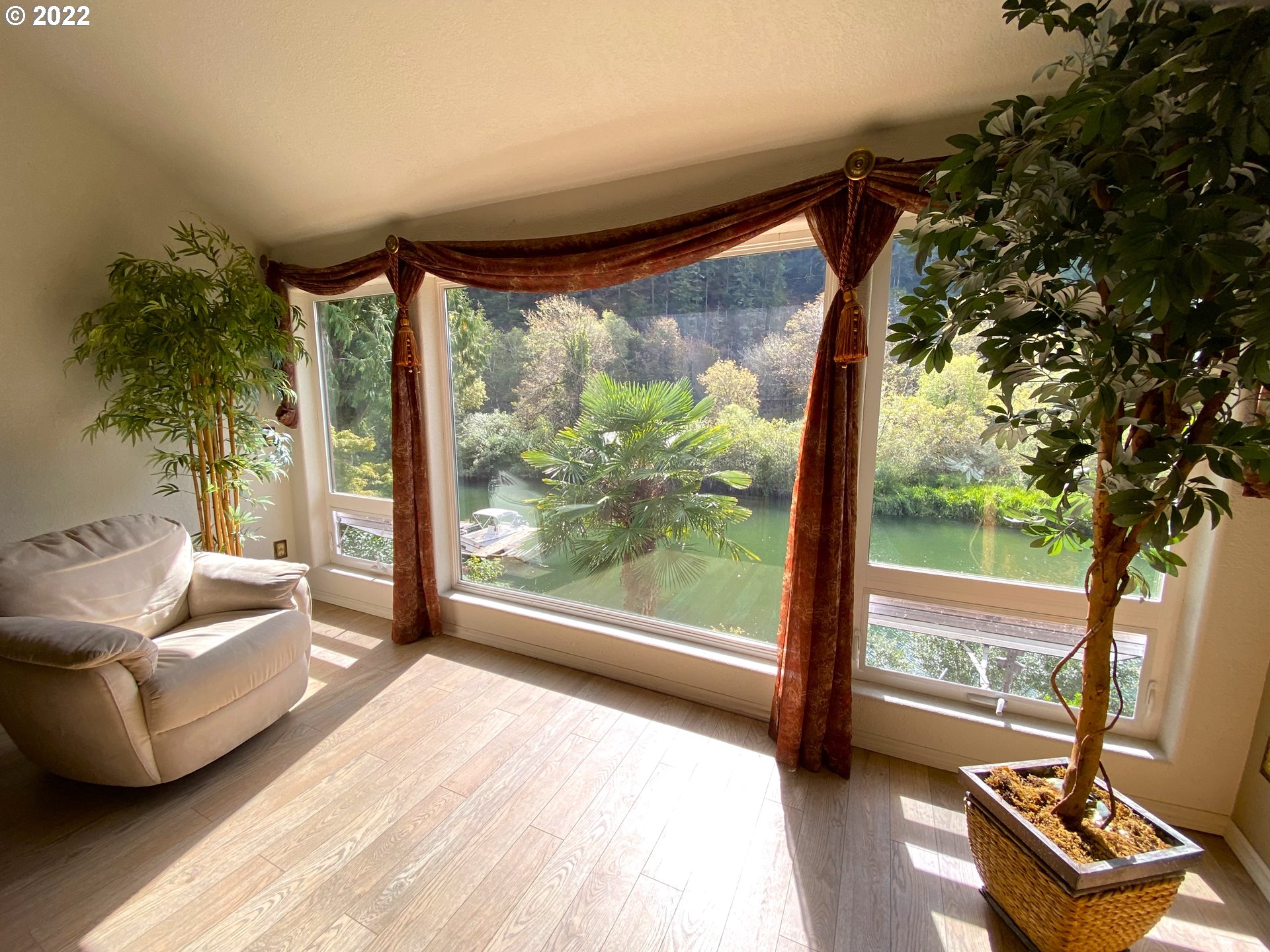43605 Highway 38, Unit 24 Reedsport, OR 97467 - Photo 9 of 27 a living room with furniture and a large window