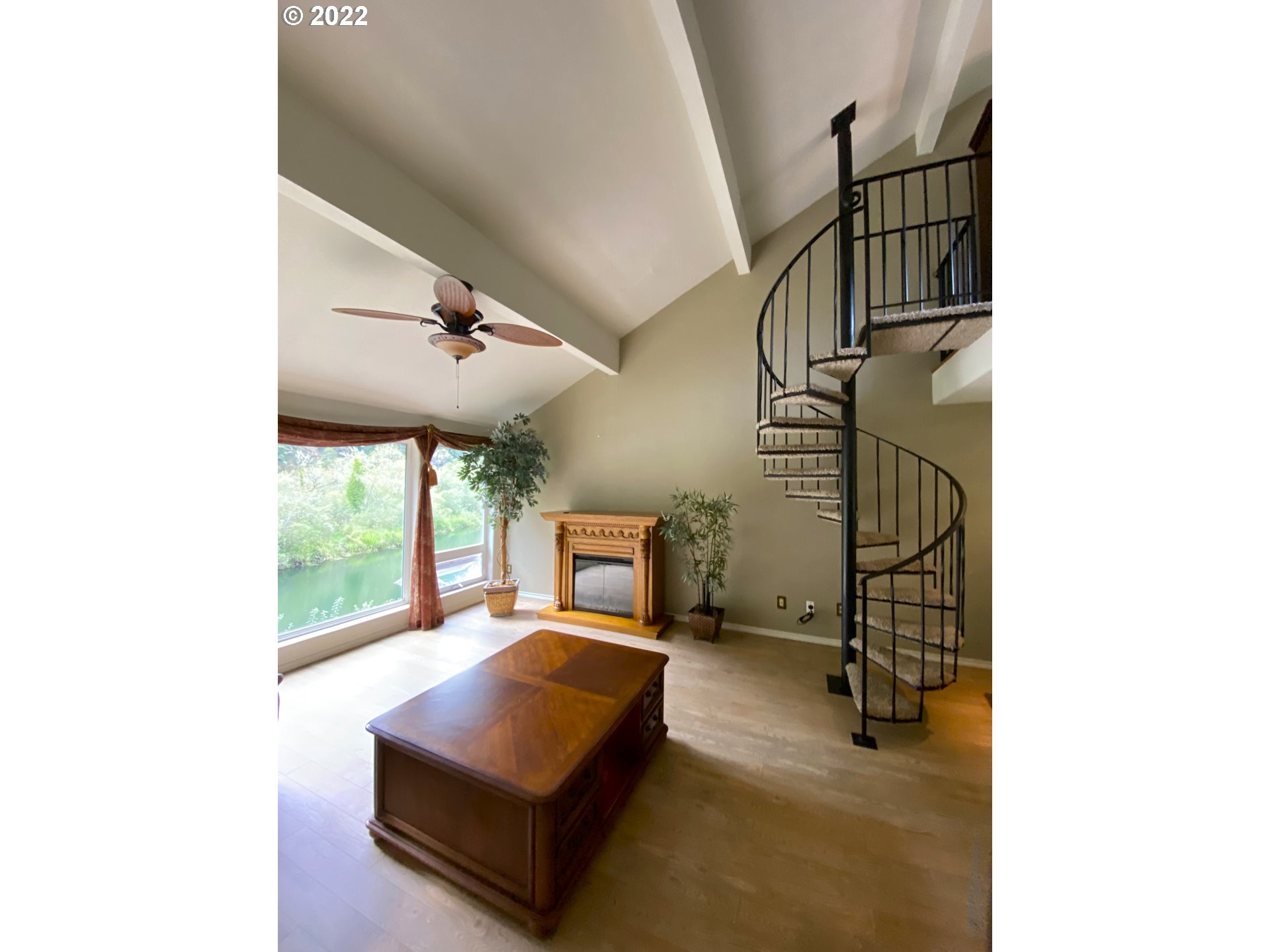 43605 Highway 38, Unit 24 Reedsport, OR 97467 - Photo 10 of 27 a living room with furniture and a floor to ceiling window