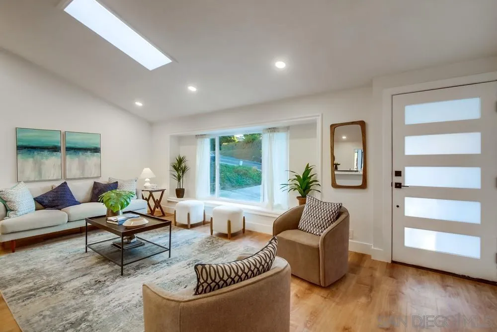 4793 54th Street San Diego, CA 92115 - Photo 15 of 74 a living room with furniture and a large window