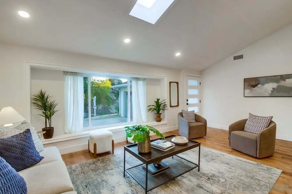 4793 54th Street San Diego, CA 92115 - Photo 16 of 74 a living room with furniture and a large window