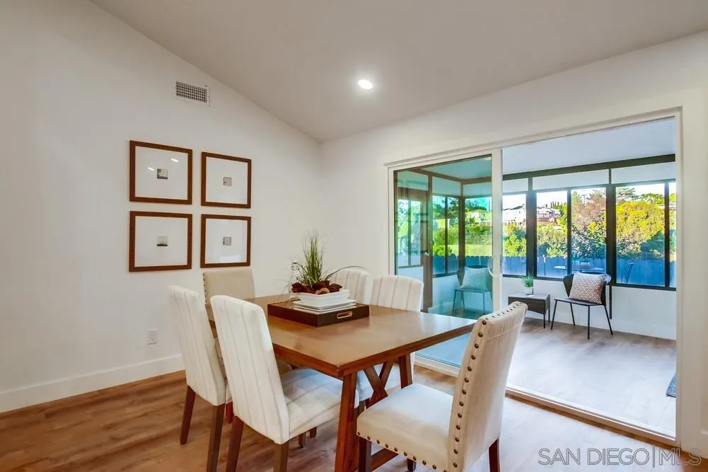 4793 54th Street San Diego, CA 92115 - Photo 20 of 74 a dining room with furniture window and wooden floor