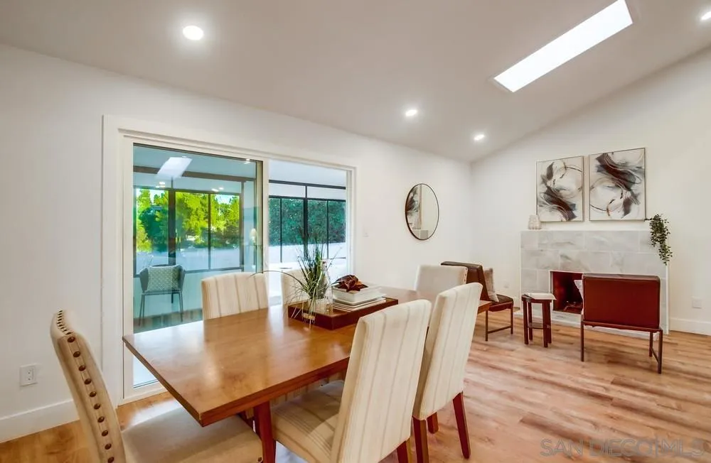 4793 54th Street San Diego, CA 92115 - Photo 21 of 74 a view of a dining room with furniture window and wooden floor