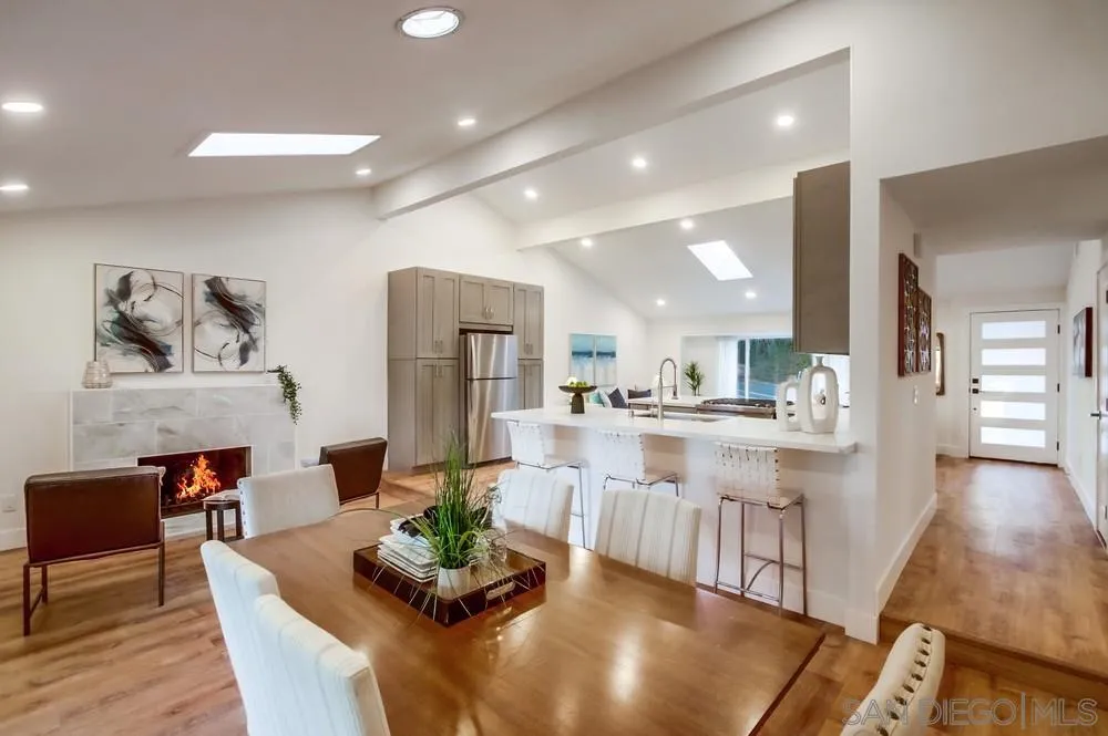 4793 54th Street San Diego, CA 92115 - Photo 23 of 74 a kitchen with stainless steel appliances granite countertop a refrigerator and a view of living room