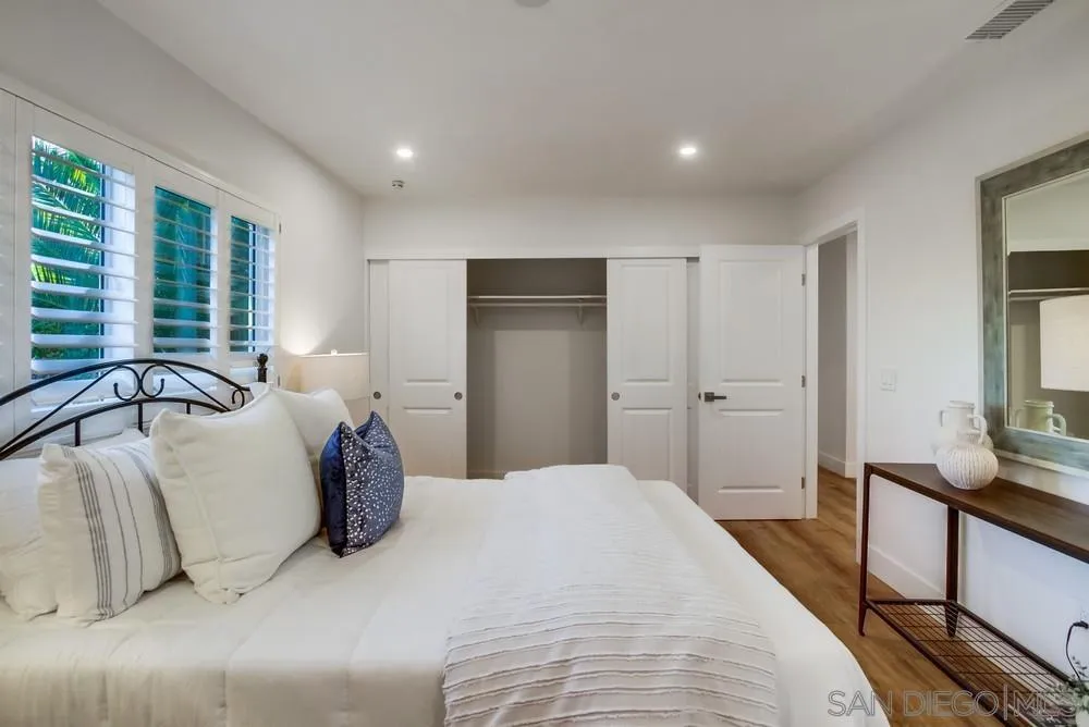 4793 54th Street San Diego, CA 92115 - Photo 35 of 74 a spacious bedroom with a bed and a flat screen television