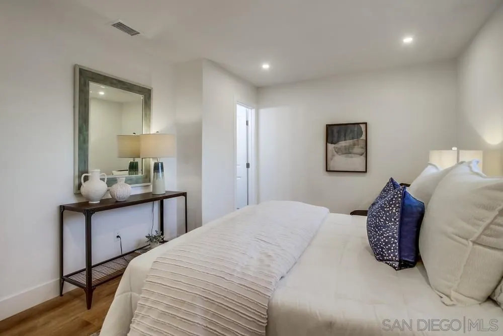 4793 54th Street San Diego, CA 92115 - Photo 36 of 74 a bedroom with a bed and a mirror