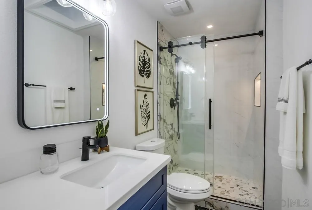 4793 54th Street San Diego, CA 92115 - Photo 38 of 74 a bathroom with a sink toilet and shower