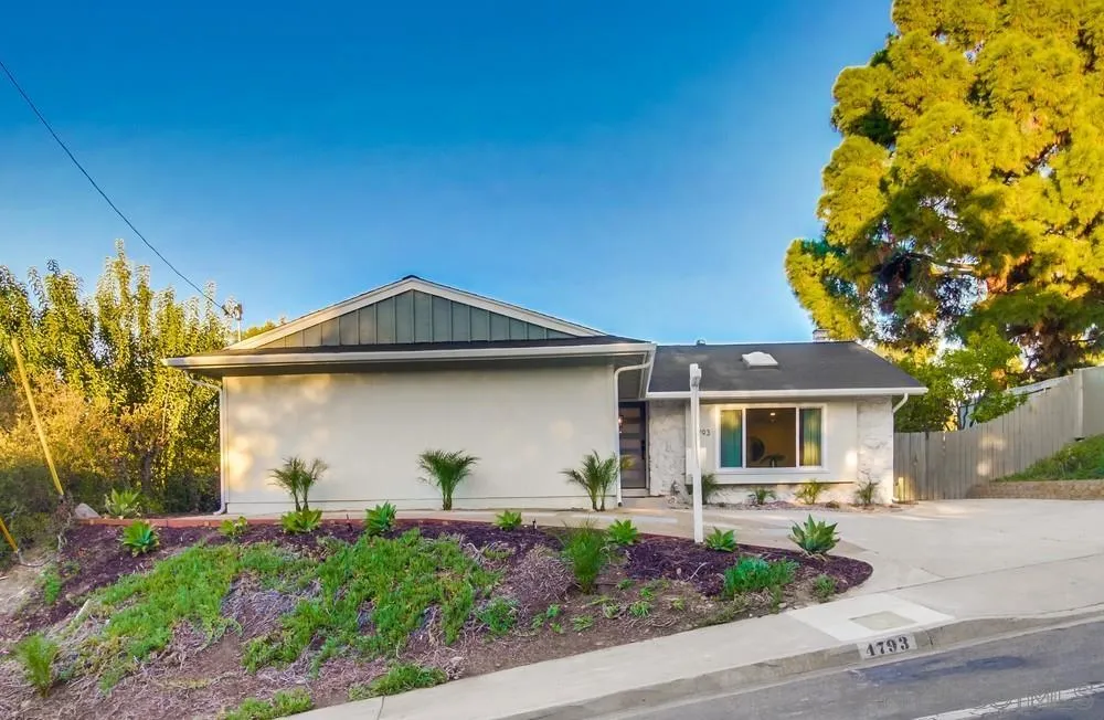 4793 54th Street San Diego, CA 92115 - Photo 49 of 74 a front view of a house with garden