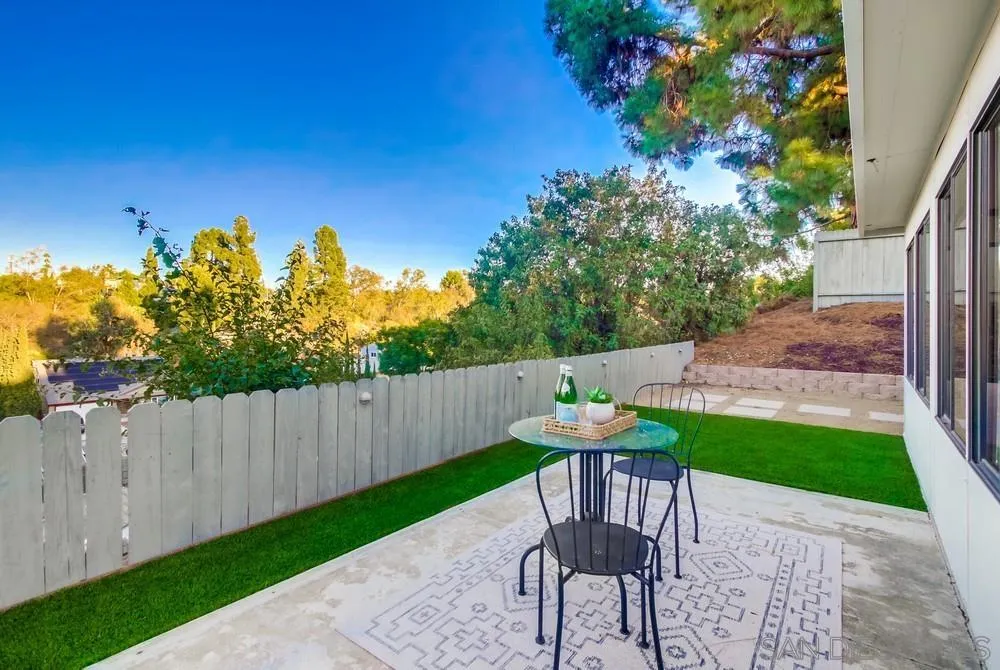 4793 54th Street San Diego, CA 92115 - Photo 55 of 74 a view of a chairs and table in the back yard