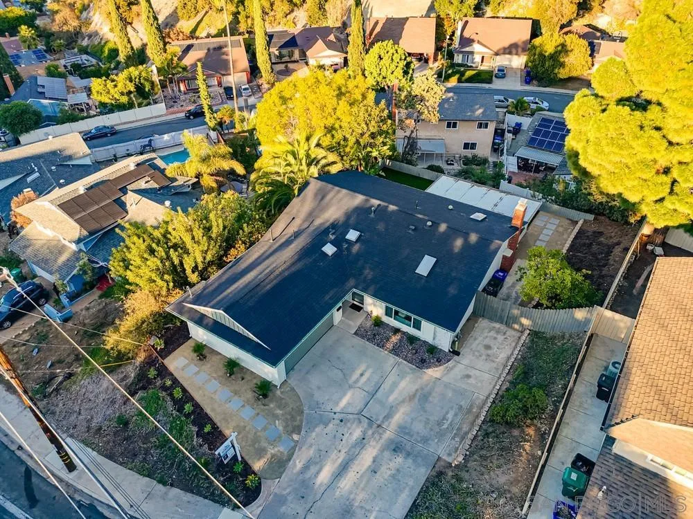 4793 54th Street San Diego, CA 92115 - Photo 69 of 74 an aerial view of a house with a yard and wooden fence