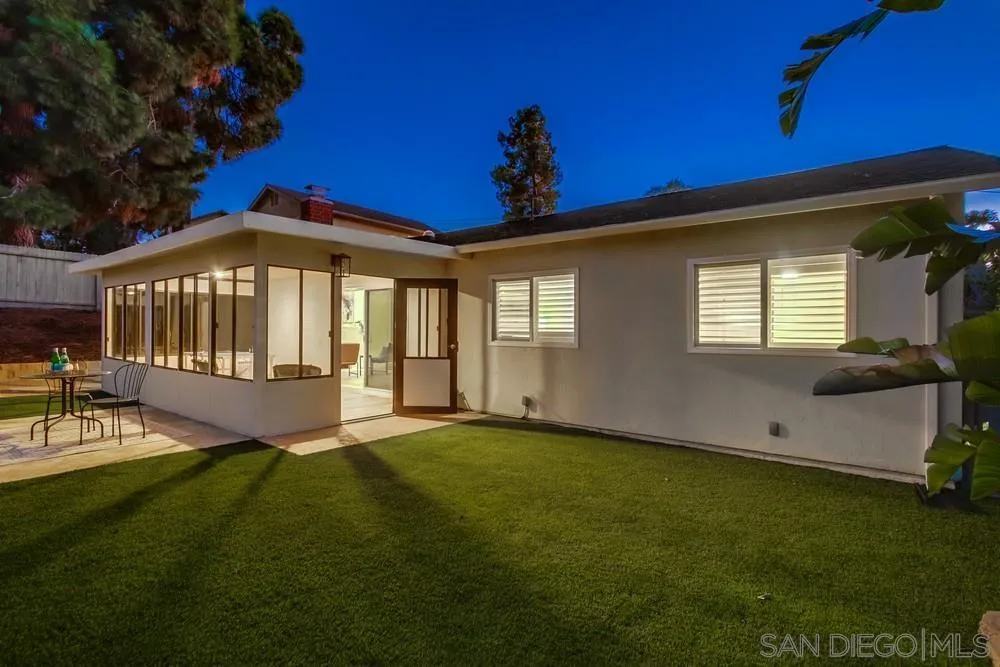 4793 54th Street San Diego, CA 92115 - Photo 7 of 74 a front view of a house with a garden